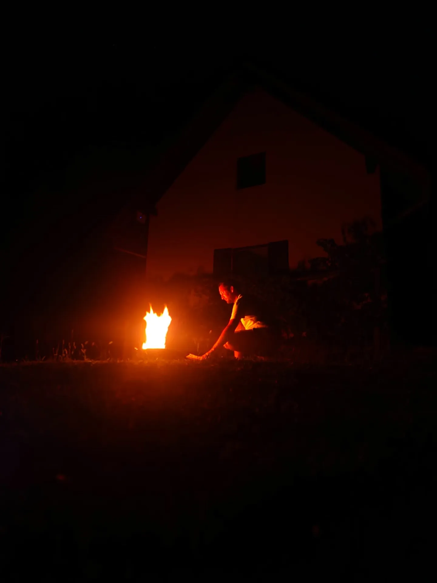 A bonfire crackling low