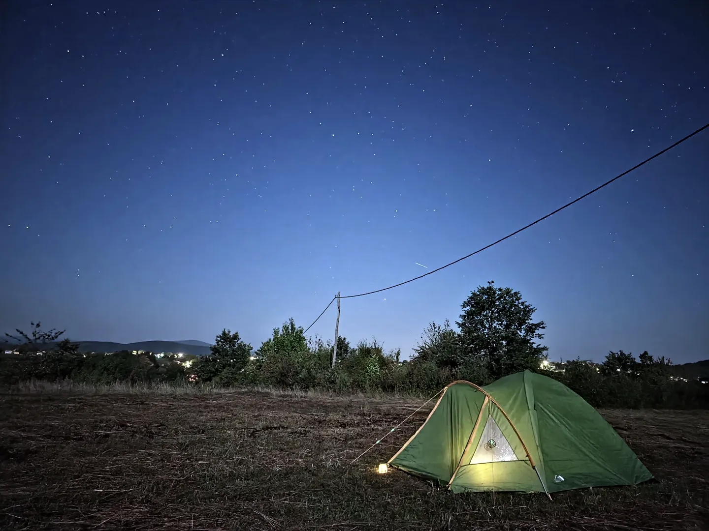 A tent pitched under the night sky